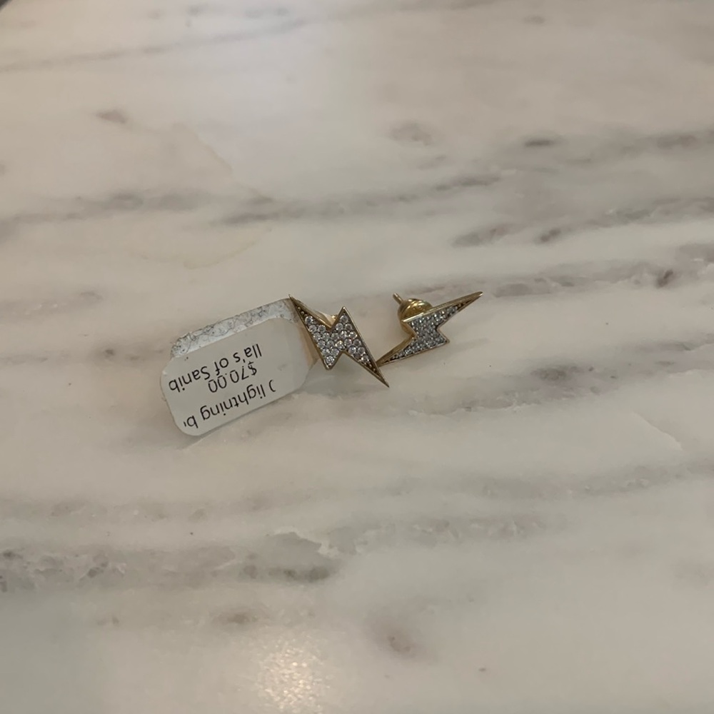 Never worn lightning bolt stud cubic zirconia and gold plated earring